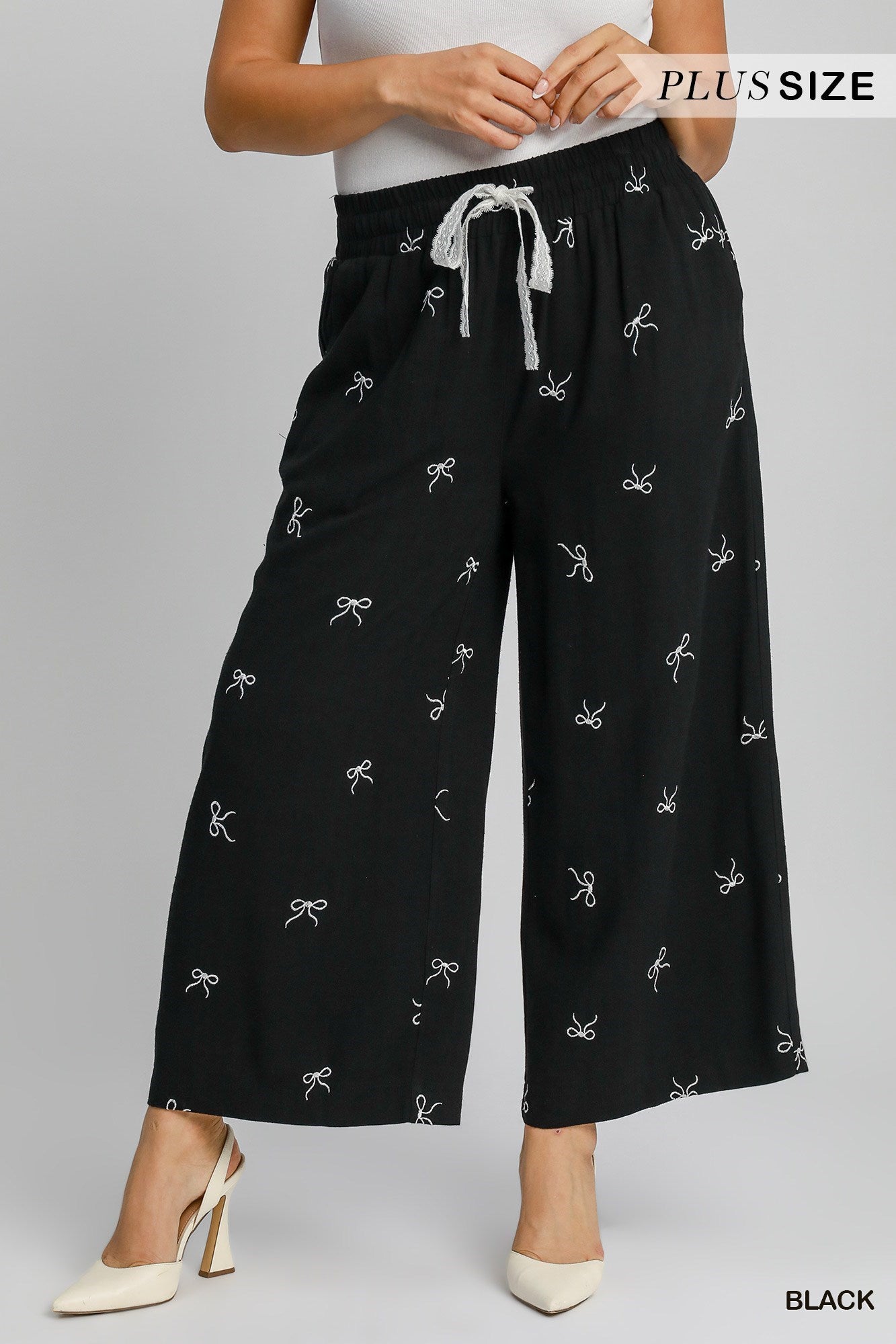 Pantalon en lin avec motifs de boucles (noir)