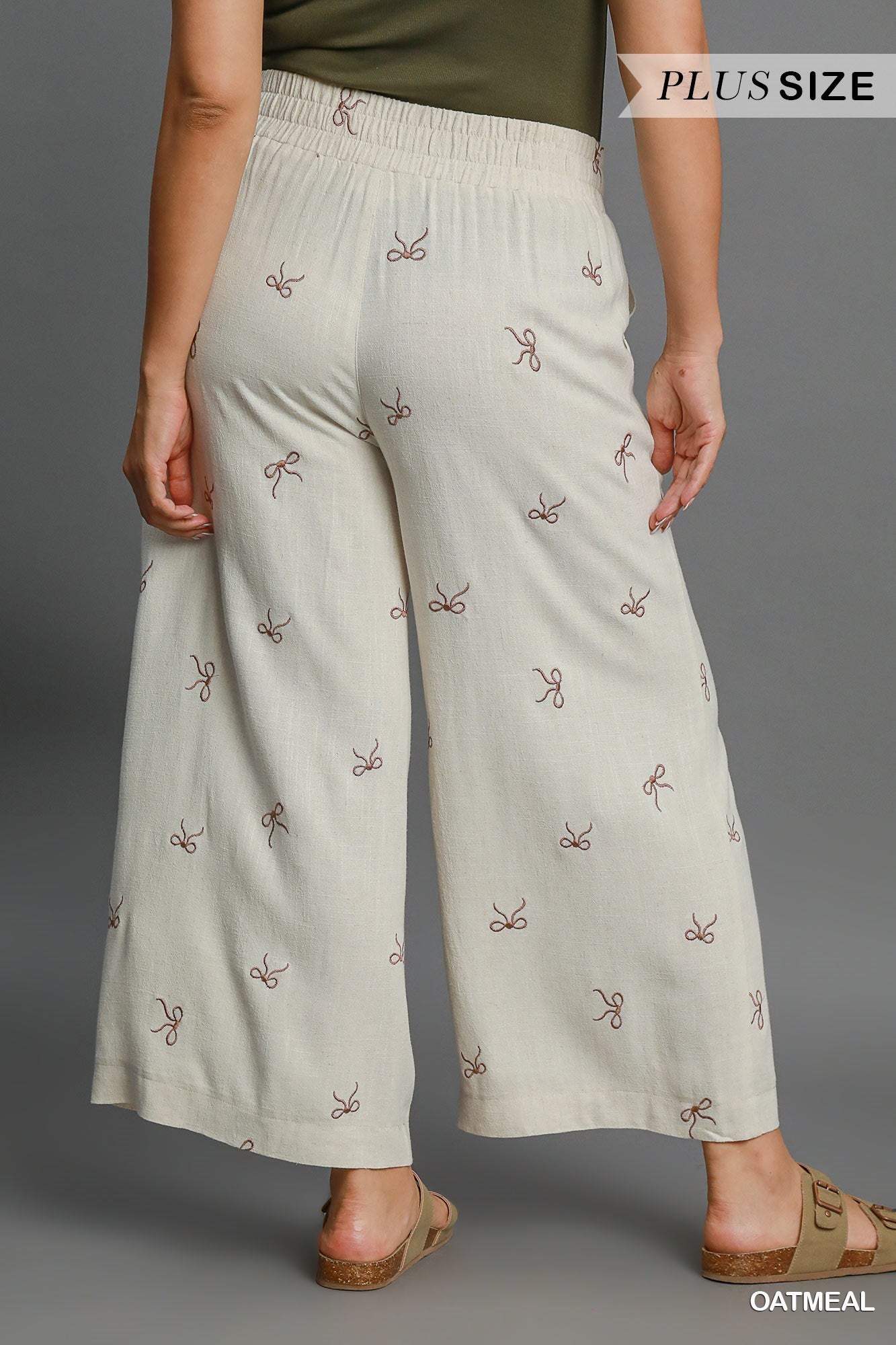 Pantalon en lin avec motifs de boucles (crème)